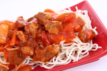 Chinese food - sweet and sour chicken with chow mein noodles