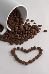 Coffee cup, coffee beans and heart