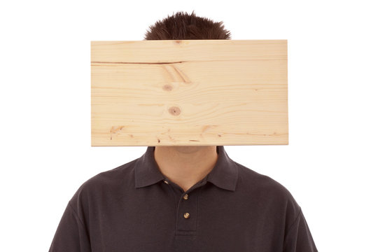 Mann mit Denkblockade - Brett vorm Kopf