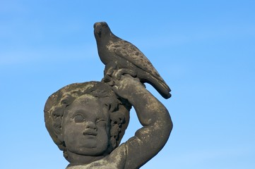 Child with bird, statue in front of Moritzburg Castle