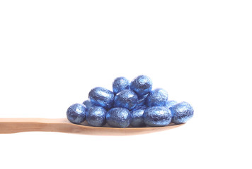 Easter eggs on a wooden spoon