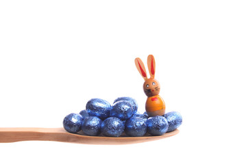 Easter eggs on a wooden spoon
