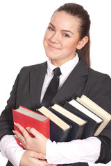 Smiling girl with books on white