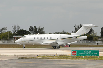 Private jet taxiing on the ground