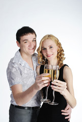 Couple of young girl and man drink champagne
