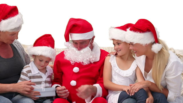 Santa Claus giving gifts to a family