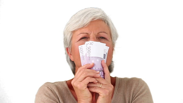 Elderly woman with notes