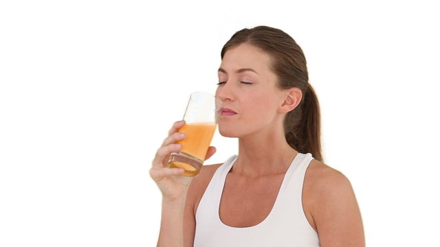 Brunette woman drinking fruit juice