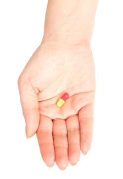 Hand holding a drug