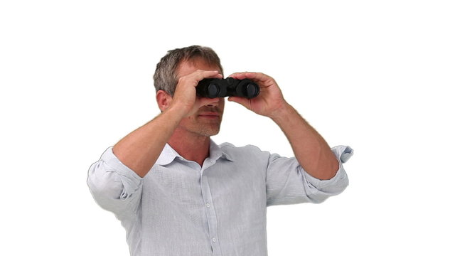 Elderly man using a pair of binoculars