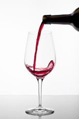 Fototapeta na wymiar Red wine poured in a glass
