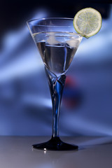 Martini Glass with green lime. Swallow dof