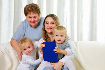 Obraz premium two twins sisters with their grandmother