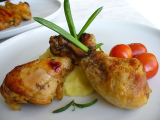 Grilled chicken on a white plate