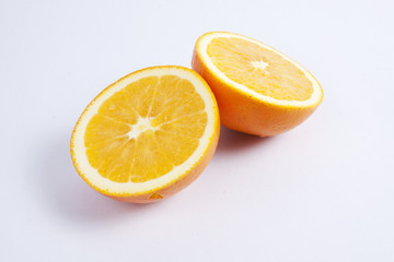 Two pieces of orange, showing texture.