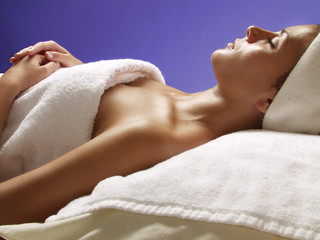 Beautiful young woman relaxing at beauty salon.