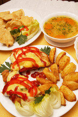 pork chop with cheese and roasted potatoes