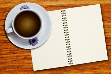 white cup of coffee and notebook
