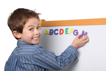 young boy learning the ABC