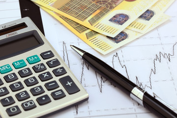 financial charts and graphs on the table