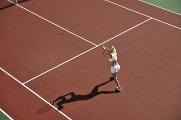 young woman play tennis outdoor