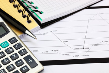 financial charts and graphs on the table