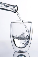 Water falling into glass