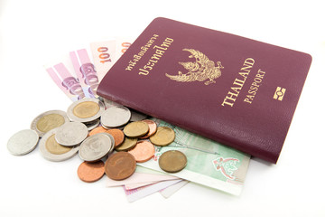 Thailand passport and Thai money on white background