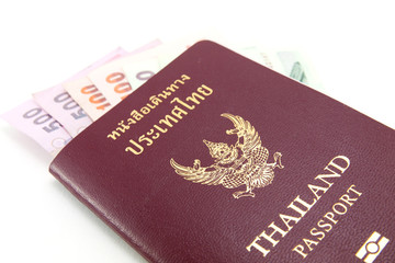 Thailand passport and Thai money on white background
