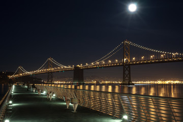 Bay Bridge at Night from pier in San Francisco