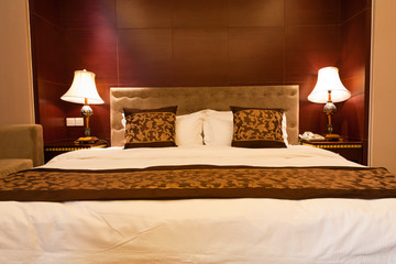 Hotel bedroom with kingsized bed and lamps