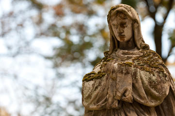 Monument Lady of Guadalupe on a cemetery