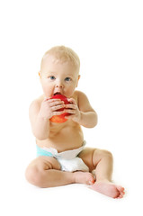 little girl eat ripe red apple