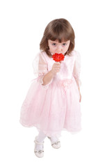 four-year girl in a beautiful pink dress with  sugar candy.
