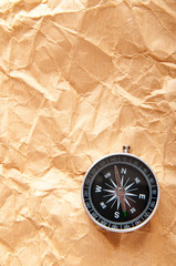 Fototapeta na wymiar Vintage compass on the paper in adventure concept