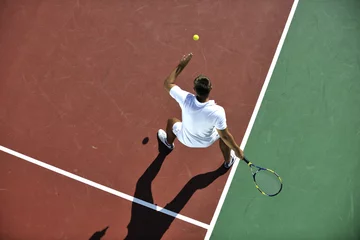 Rolgordijnen young man play tennis © .shock