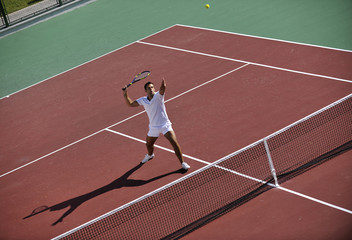young man play tennis