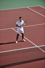 young man play tennis