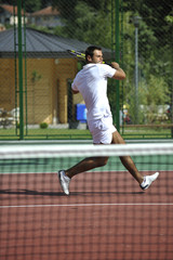 young man play tennis