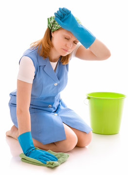 Tired Woman Cleaning The Floor With A Rag