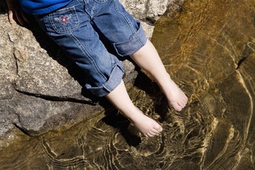A Little Girls Toes Testing The Water
