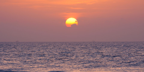 rising sun above the ocean