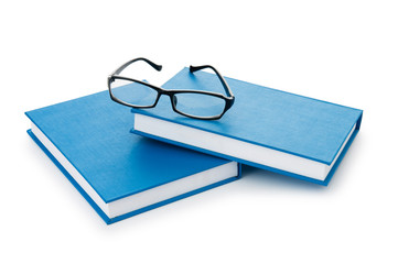 Reading glasses with books isolated on the white