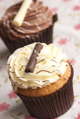 Cupcakes topped with buttercream and chocolate