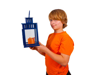 cute boy holding a hand lantern