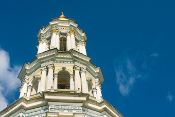 Obraz premium Bell tower and blue cloudy sky