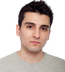 Obraz premium Young man applying eye cream