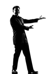silhouette man showing gesture introducing presentation