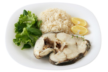 Boiled fish with rice and lemon