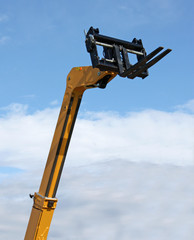 A High Lift Yellow Hydraulic Fork Lift Truck.